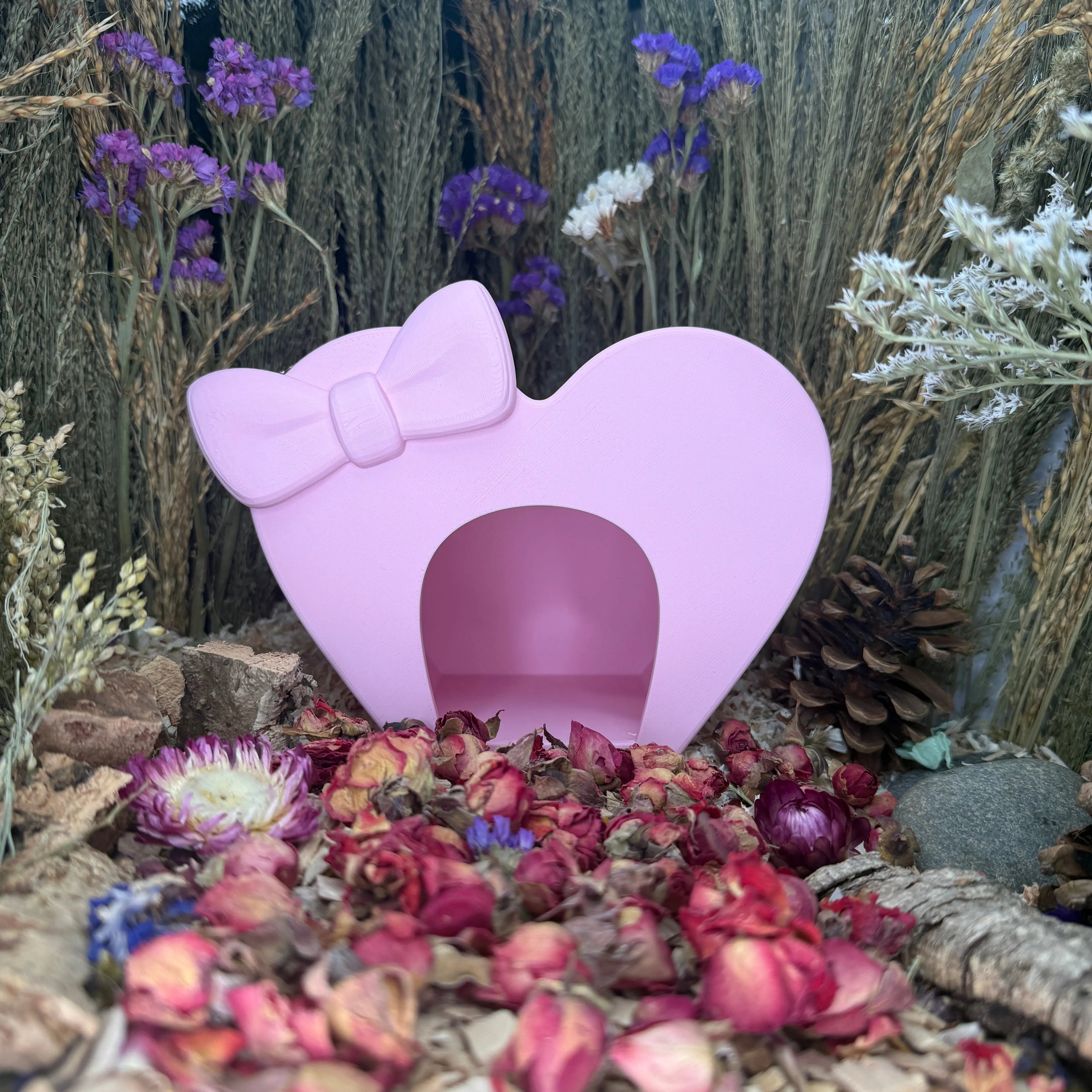 Heart-shaped hideout inside a hamster enclosure for resting and nesting