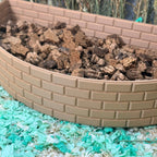 Curved brick wall hamster dig box