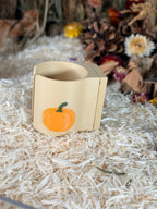 Magnetic pumpkin hamster water bottle holder in an autumn enclosure